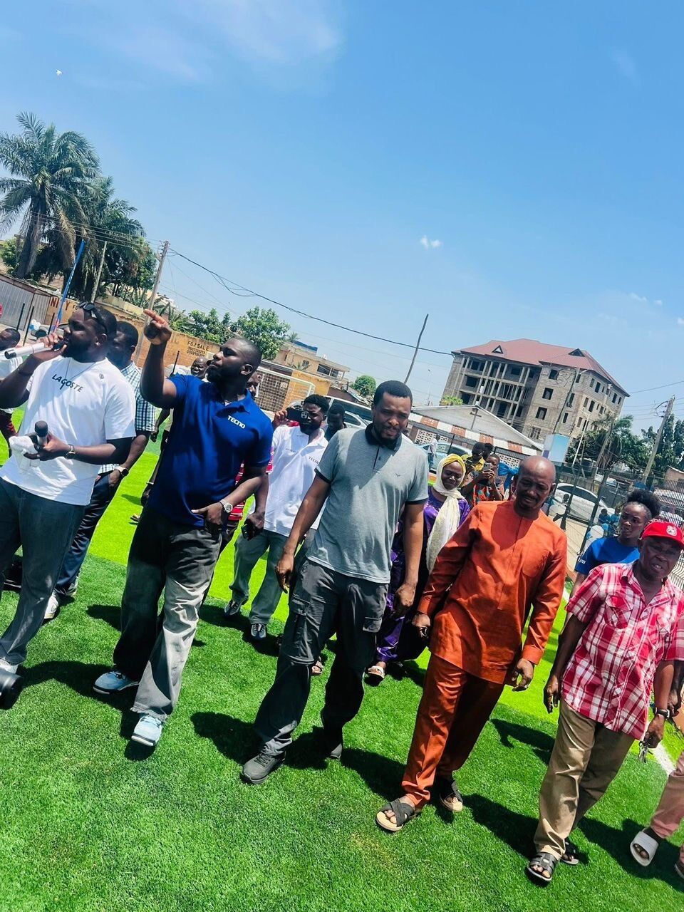 The MP, Techno team and Assemblyman inspect the new astro turf at Panama