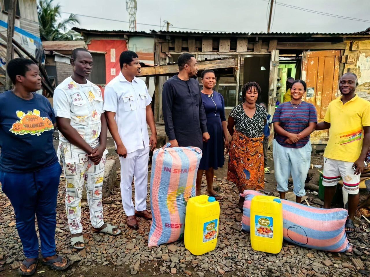 The MP with kenkey sellers receiving maize and cooking oil